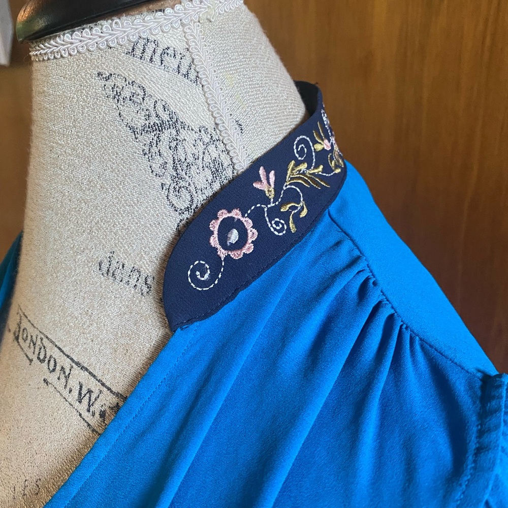 HD Paris blouse with embroidered collar and fluttery sleeves in vibrant blue